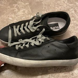 Golden Goose Deluxe Brand Unisex Distressed Leather Low Top Sneakers in black